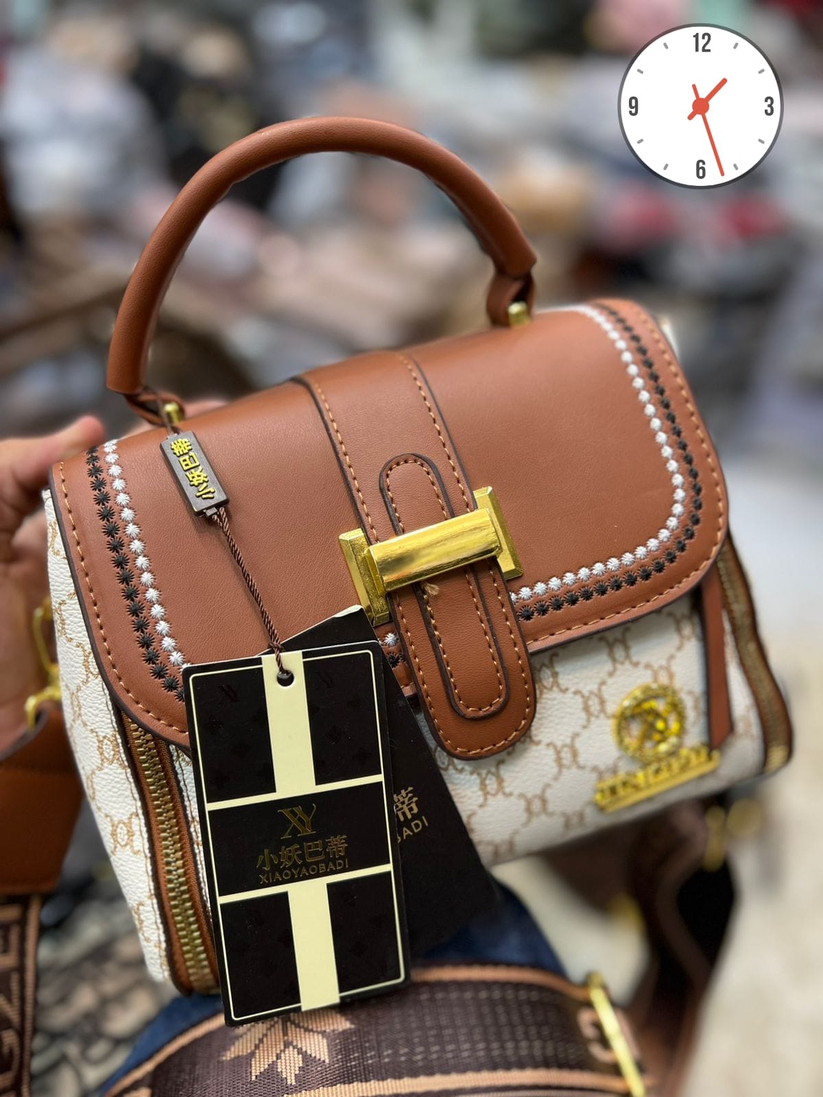 Elegant Two-Tone Structured Satchel with Unique Chain Detail