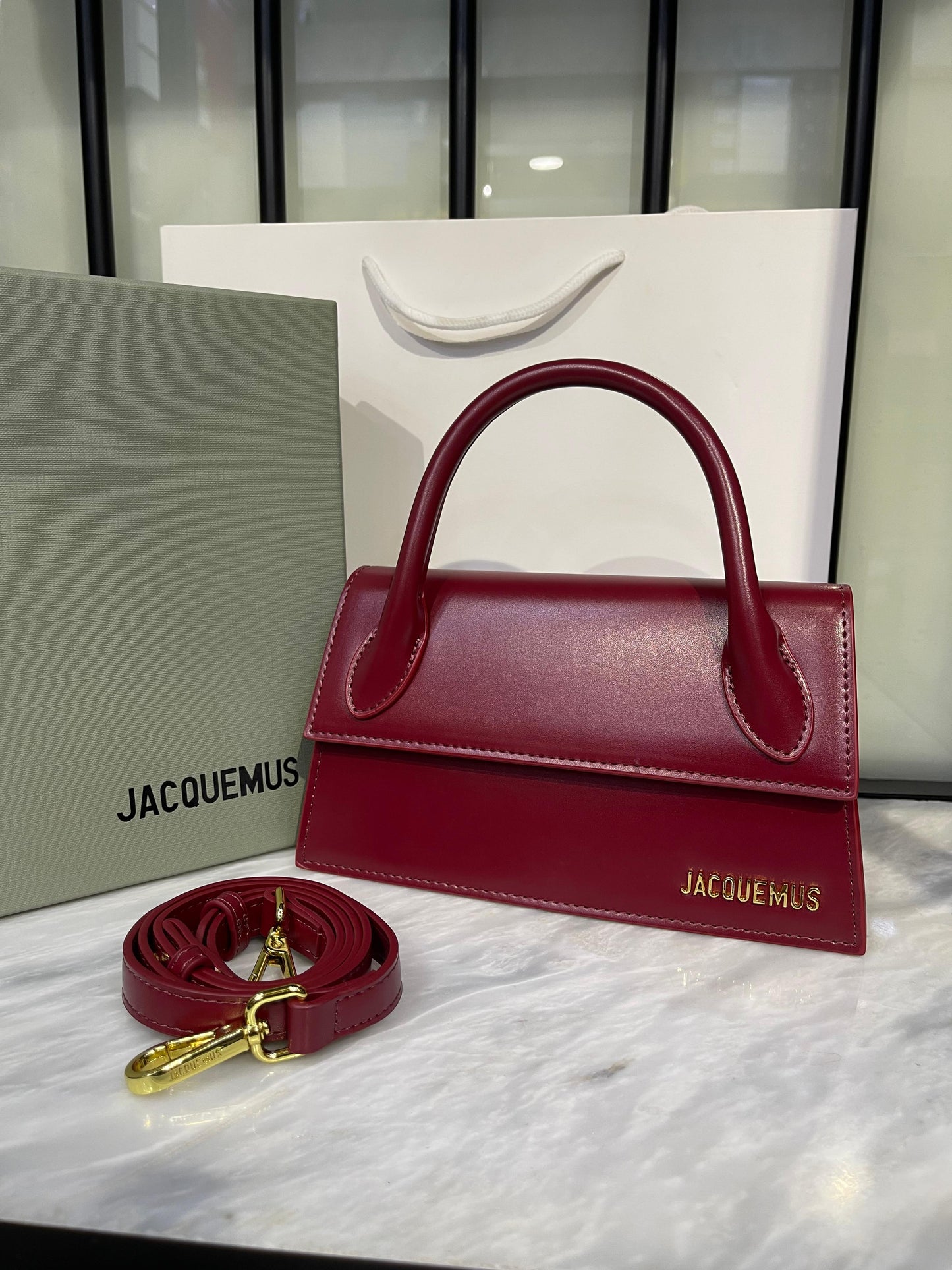 Elegant Sculptural Top-Handle Bag with Gold Hardware