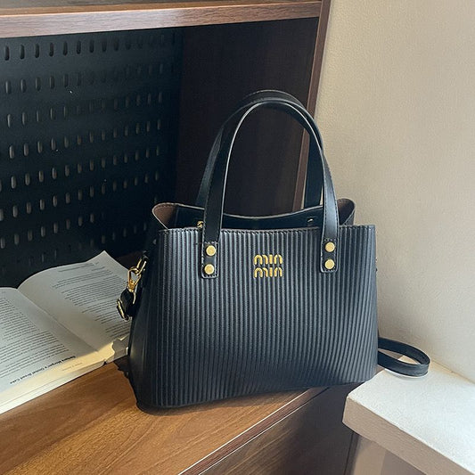 Textured Elegant Handbag with Gold Detailing