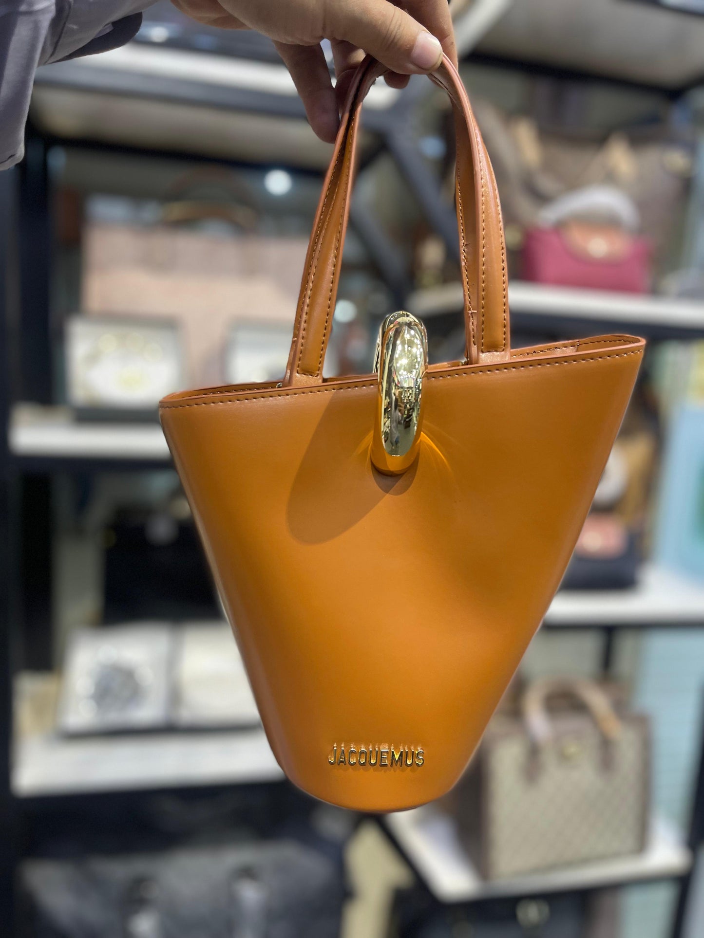 Sculptural Vegan Leather Bucket Bag with Gold Hardware Accent