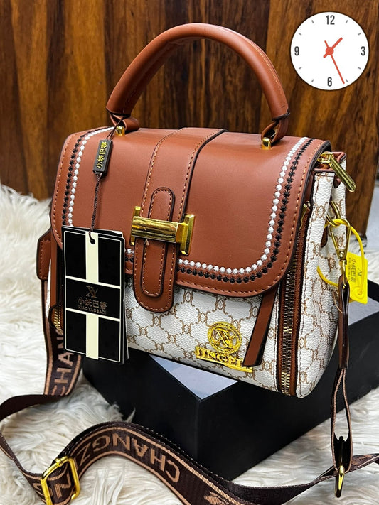 Elegant Two-Tone Structured Satchel with Unique Chain Detail